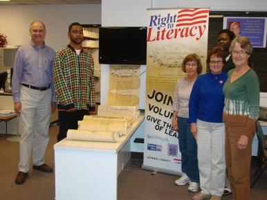 Adult Literacy Center Group photo with scroll